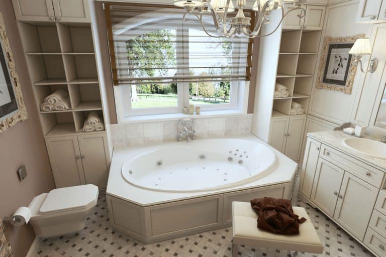 A nice angle view of a bathroom with installed bathtubs and vanitiy top